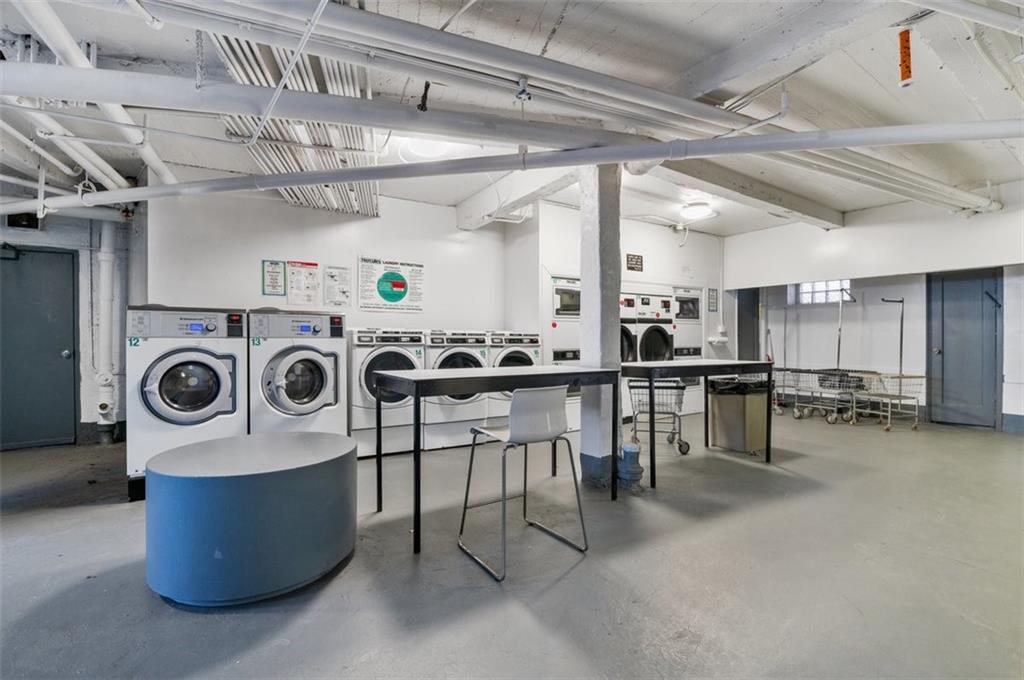 7119 Shore Road, Unit 2G Brooklyn, NY 11209 - Photo 5 of 22 a view of a room with wooden furniture and kitchen view