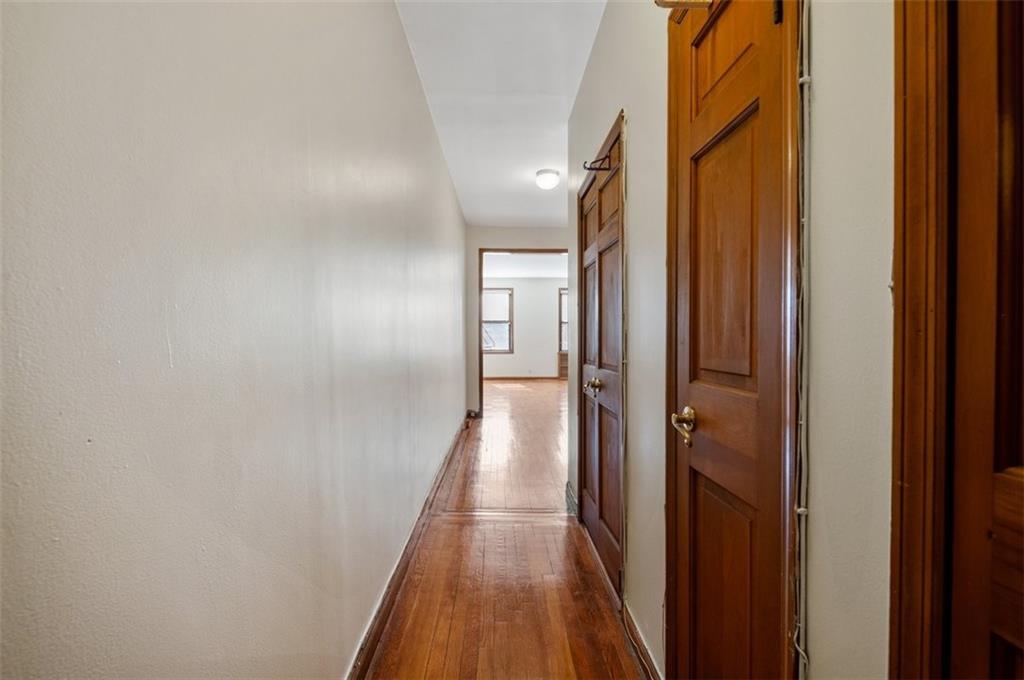 7119 Shore Road, Unit 2G Brooklyn, NY 11209 - Photo 6 of 22 a view of a hallway with a wooden floor
