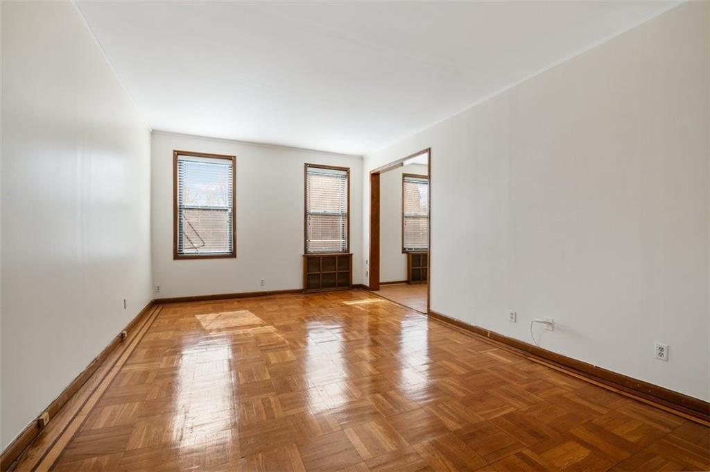 7119 Shore Road, Unit 2G Brooklyn, NY 11209 - Photo 7 of 22 a view of an empty room and window