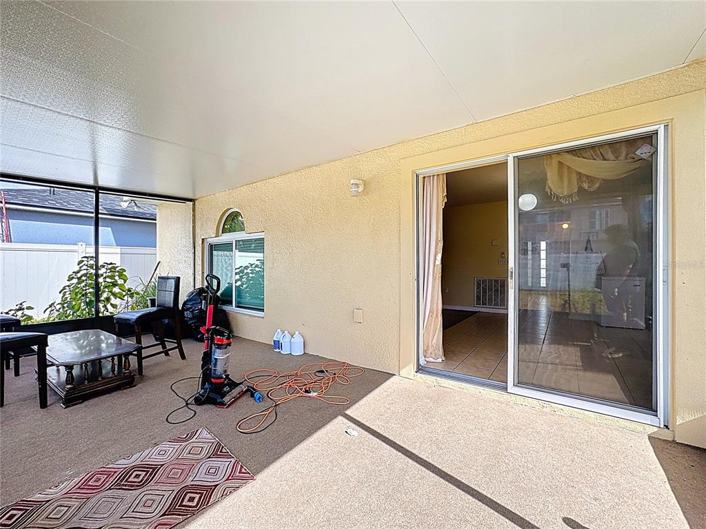 2620 Hunley Loop Kissimmee, FL 34743 - Photo 12 of 52 a living room with furniture a lamp and potted plant