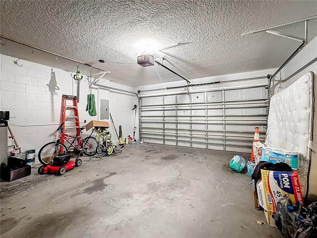 2620 Hunley Loop Kissimmee, FL 34743 - Photo 14 of 52 a view of a garage with rack and bicycle