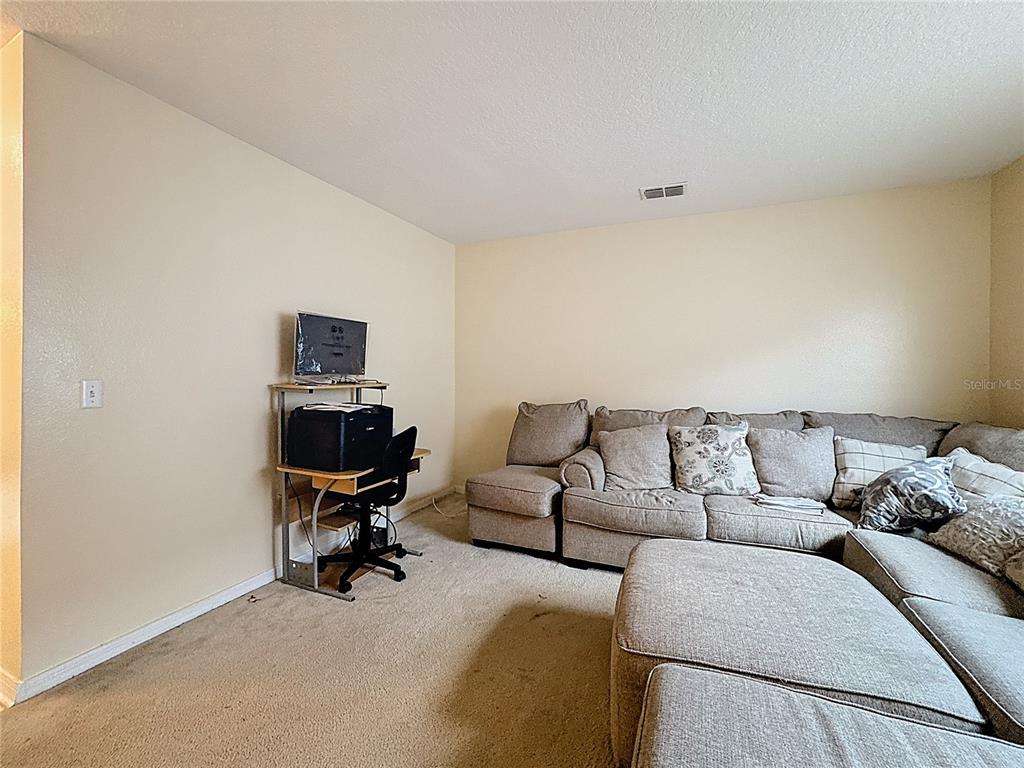 2620 Hunley Loop Kissimmee, FL 34743 - Photo 34 of 52 a living room with furniture