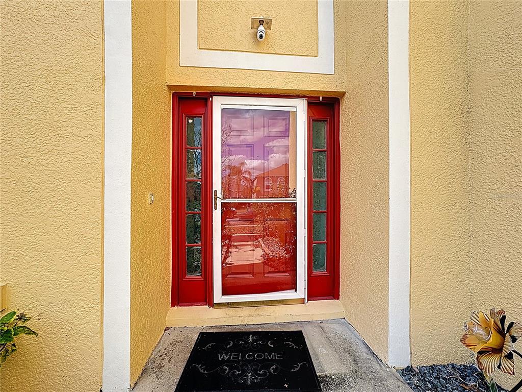 2620 Hunley Loop Kissimmee, FL 34743 - Photo 42 of 52 a view of a hallway with wooden door and entryway