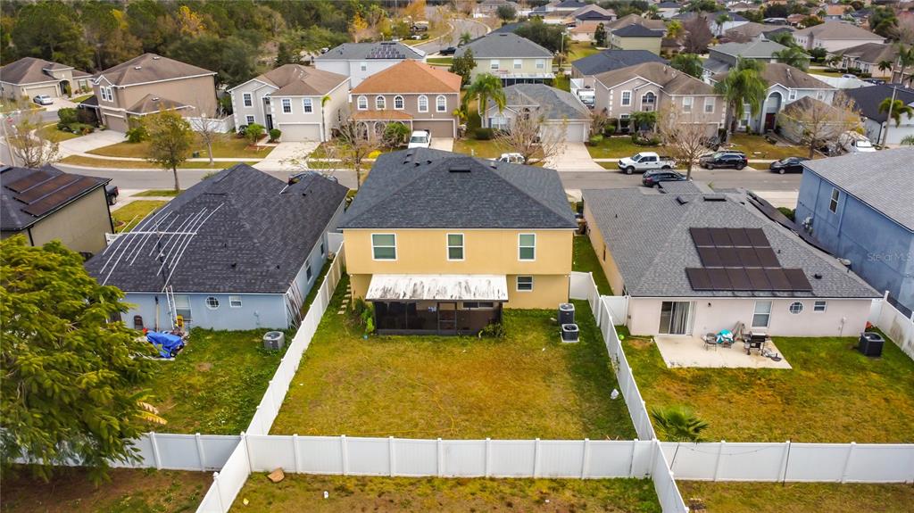 2620 Hunley Loop Kissimmee, FL 34743 - Photo 48 of 52 a aerial view of residential houses with yard