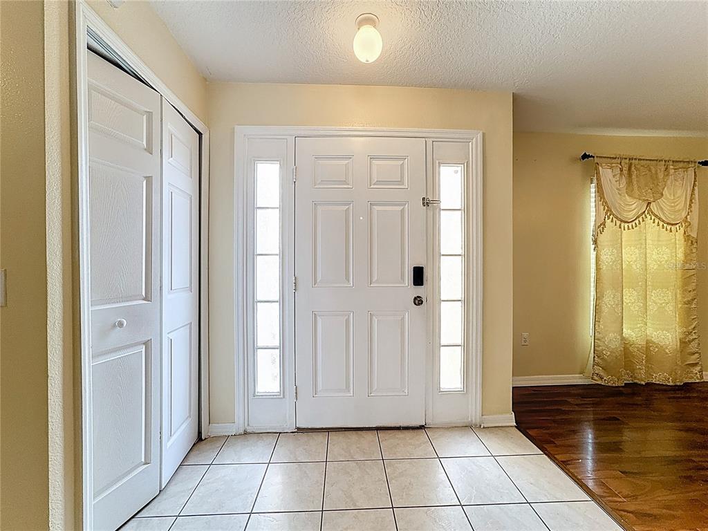 2620 Hunley Loop Kissimmee, FL 34743 - Photo 9 of 52 a view of a entryway door with interior of the house