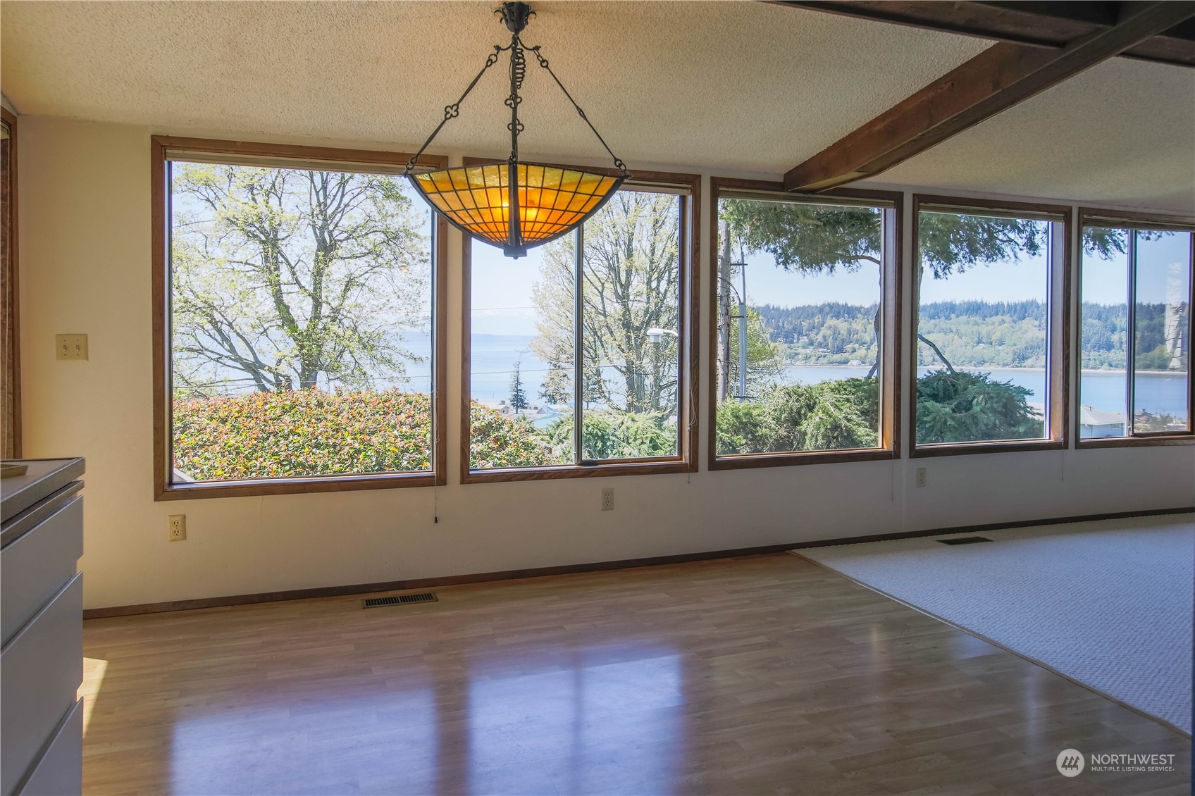 8168 Cultus Bay Road Clinton, WA 98236 - Photo 12 of 38 an empty room with a window and ceiling fan