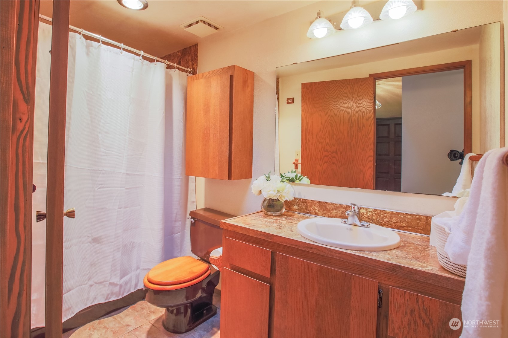 8168 Cultus Bay Road Clinton, WA 98236 - Photo 14 of 38 a bathroom with a sink toilet and shower