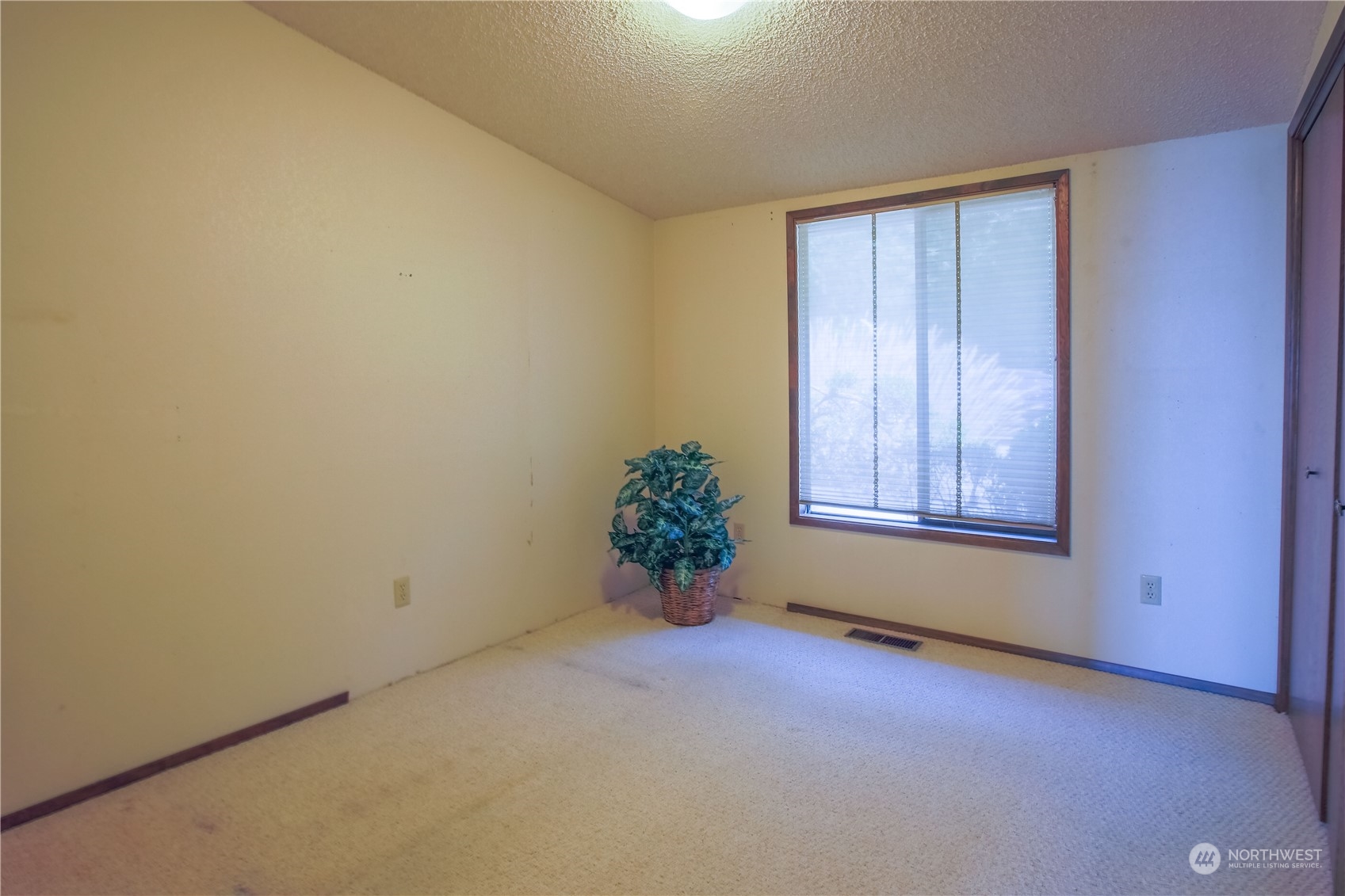 8168 Cultus Bay Road Clinton, WA 98236 - Photo 15 of 38 an empty room with windows