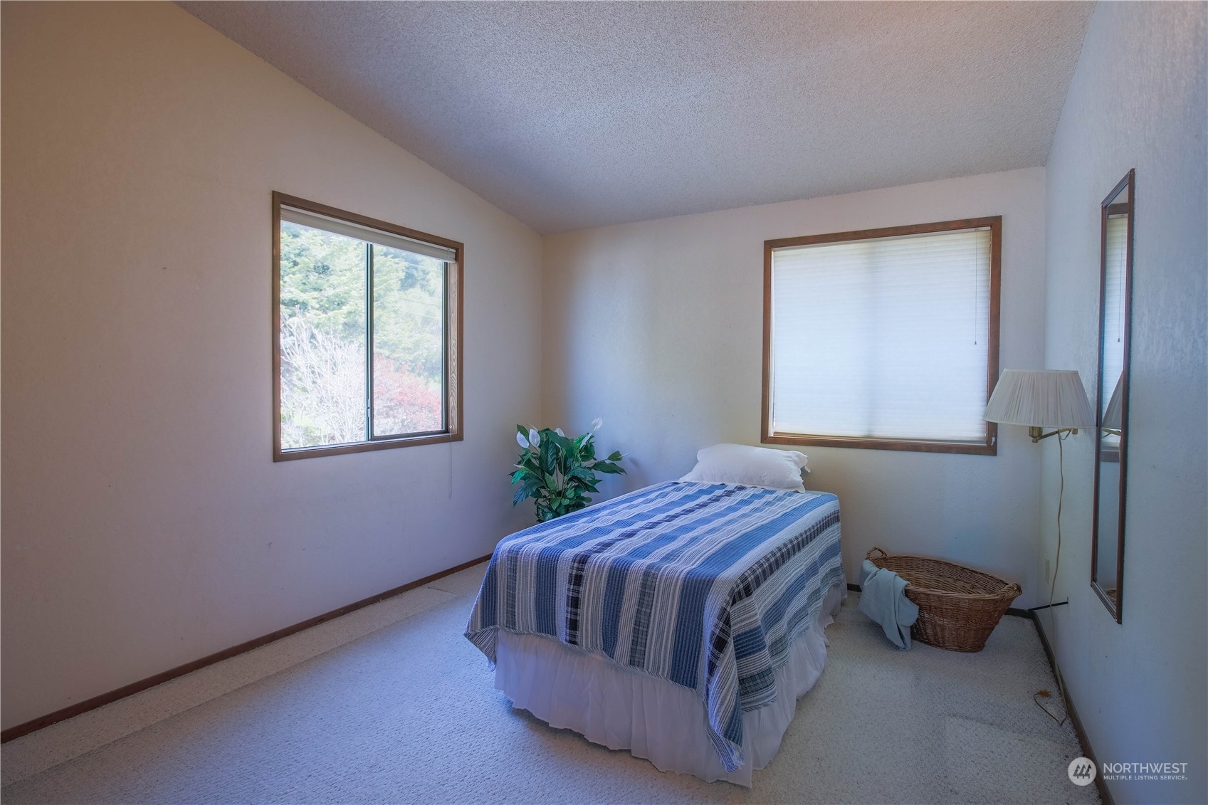 8168 Cultus Bay Road Clinton, WA 98236 - Photo 18 of 38 a bedroom with a bed and a window