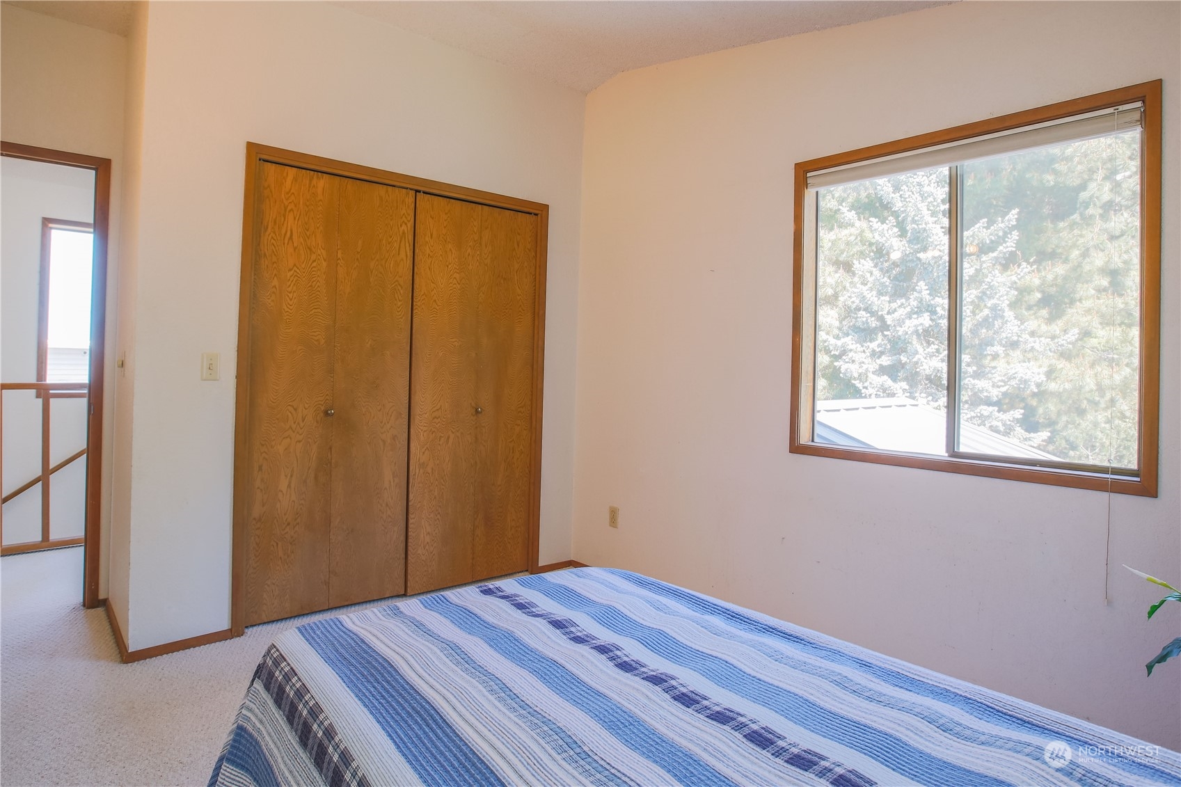 8168 Cultus Bay Road Clinton, WA 98236 - Photo 19 of 38 a bedroom with a bed and a window