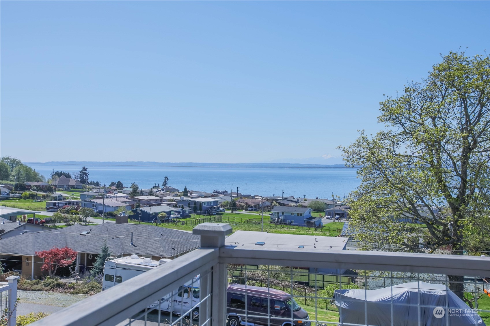 8168 Cultus Bay Road Clinton, WA 98236 - Photo 20 of 38 a view of a city from a balcony