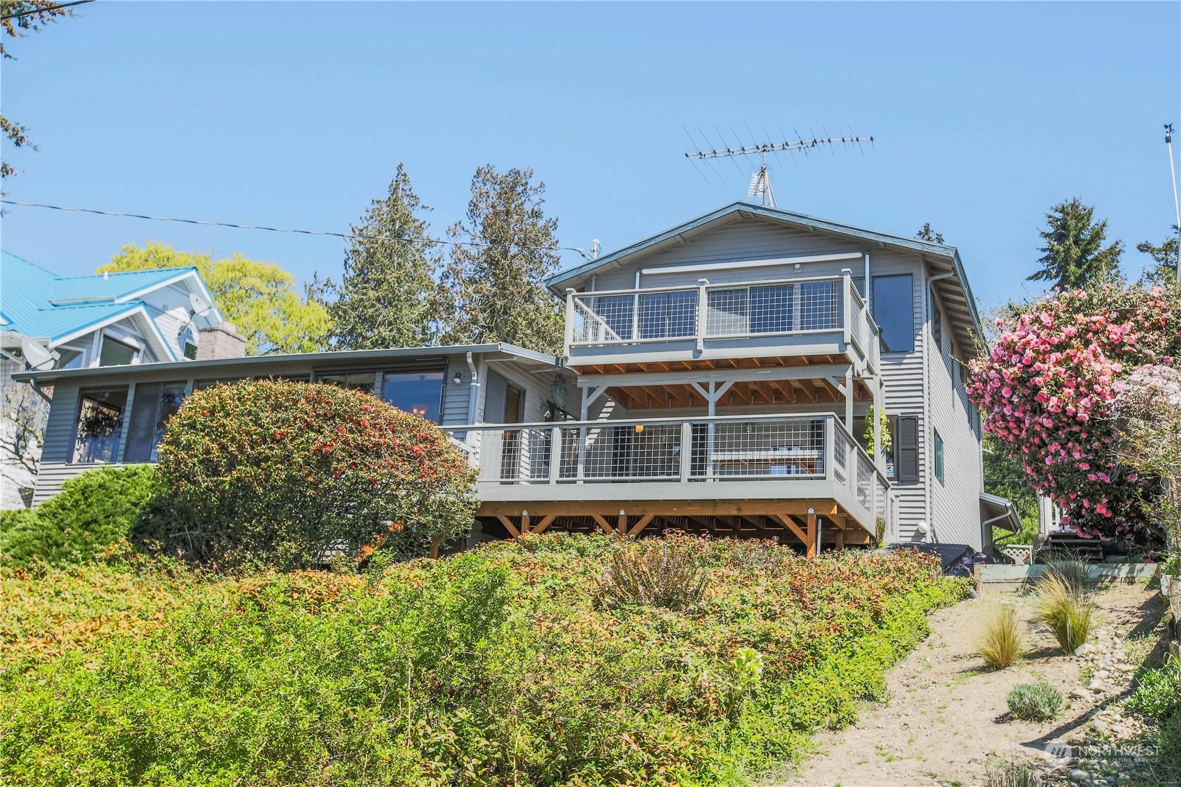8168 Cultus Bay Road Clinton, WA 98236 - Photo 38 of 38 a front view of a house with a yard