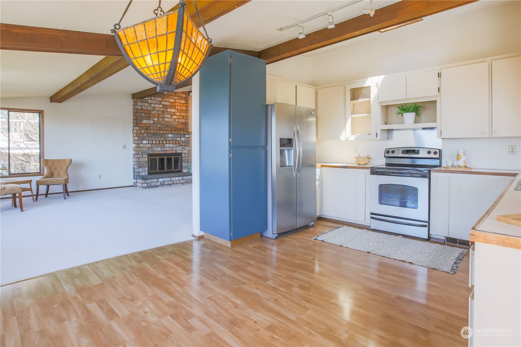 8168 Cultus Bay Road Clinton, WA 98236 - Photo 10 of 38 a view of kitchen with furniture and wooden floor