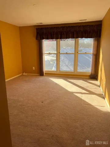 a view of a room with a large window