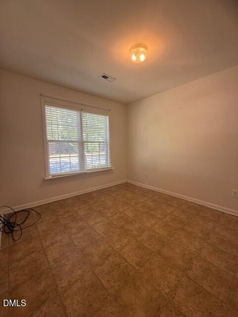 241 Highgate Circle Wake Forest, NC 27587 - Photo 11 of 12 an empty room with a window