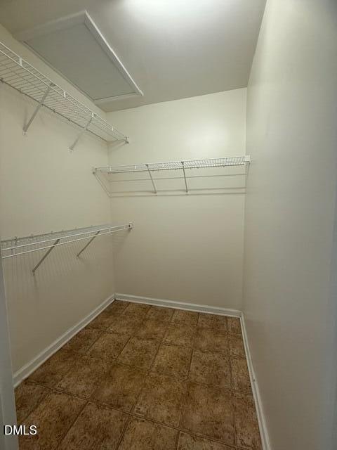 241 Highgate Circle Wake Forest, NC 27587 - Photo 9 of 12 a view of a room with racks on the wall