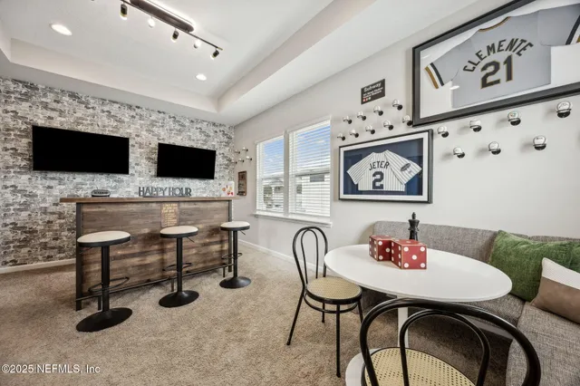 a bedroom with two beds and a window