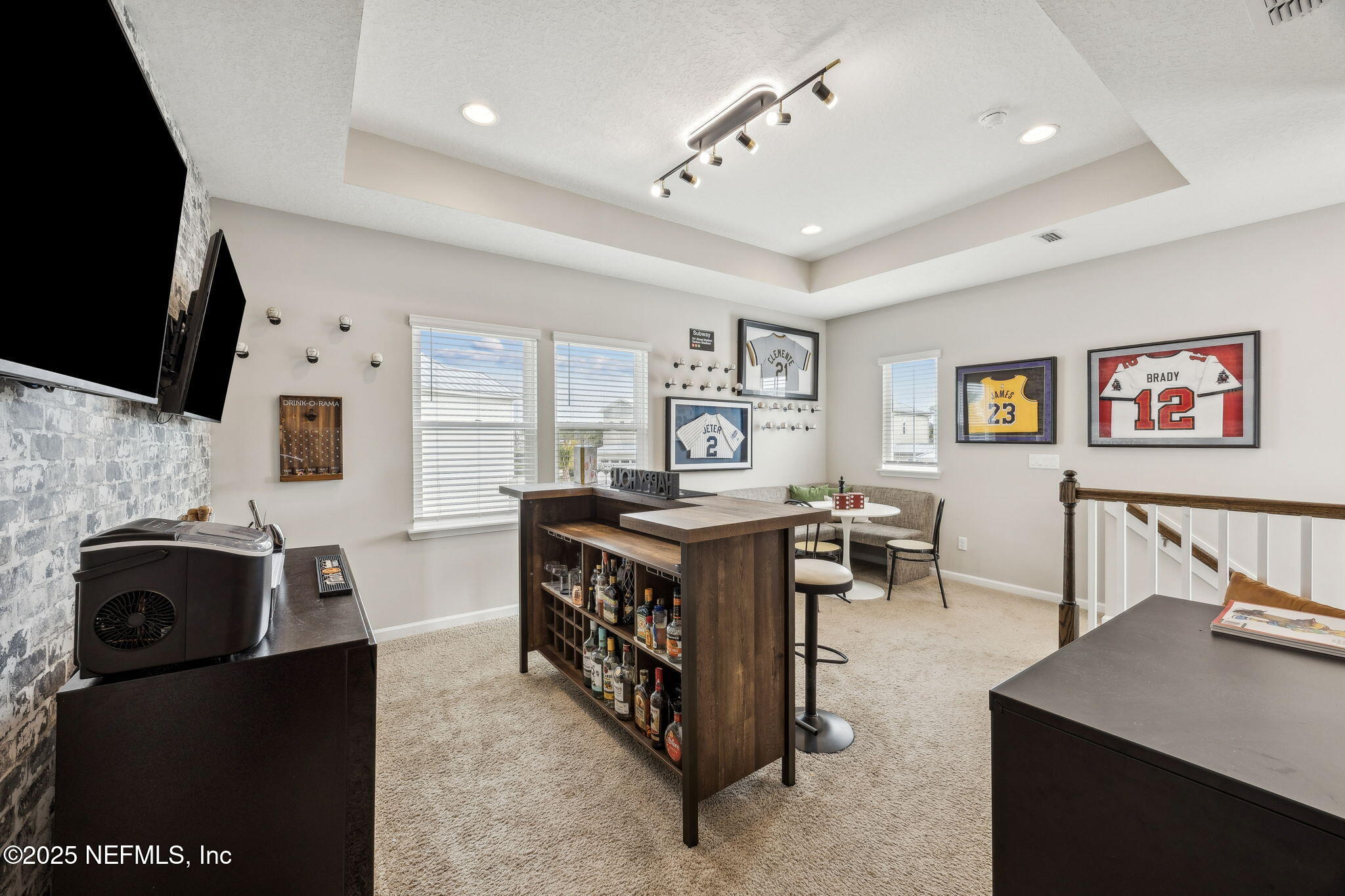 290 Rum Runner Way St. Johns, FL 32259 - Photo 25 of 105 a living room with furniture a flat screen tv and a fireplace