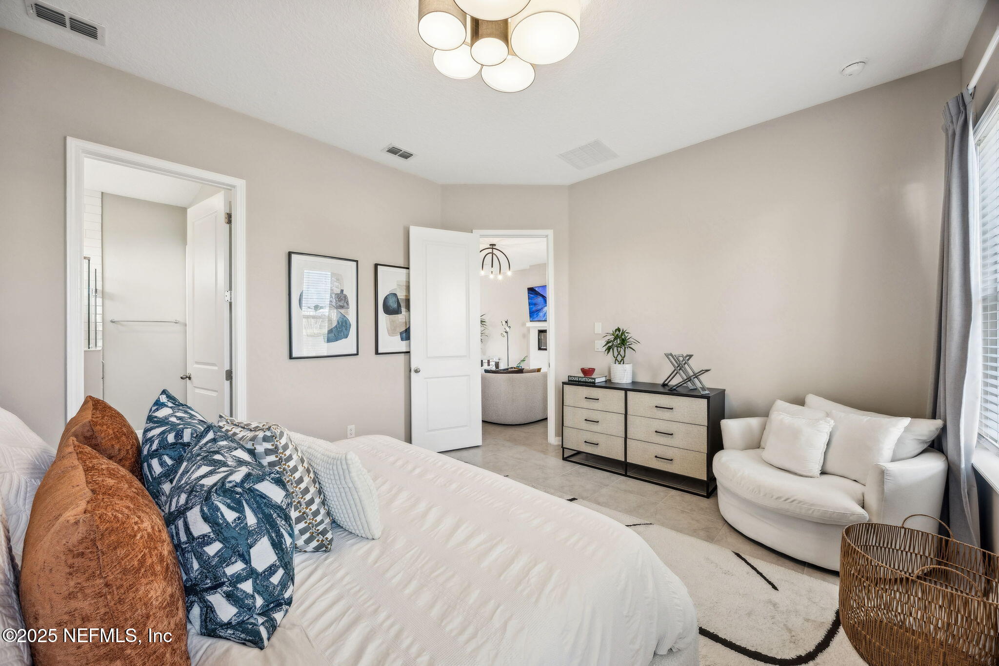 290 Rum Runner Way St. Johns, FL 32259 - Photo 30 of 105 a bedroom with a bed and ceiling fan