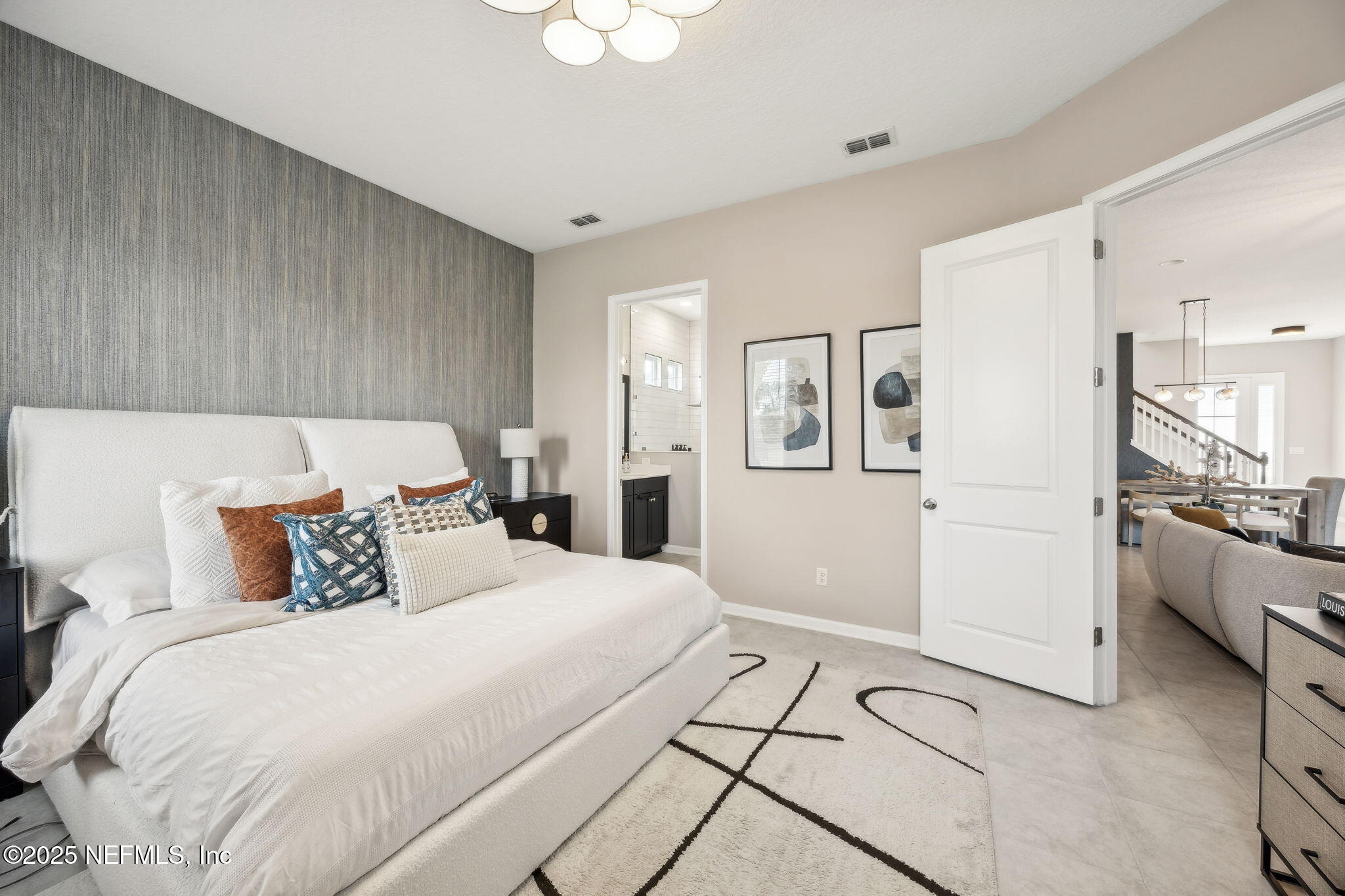 290 Rum Runner Way St. Johns, FL 32259 - Photo 31 of 105 a bedroom with a large bed and a chandelier