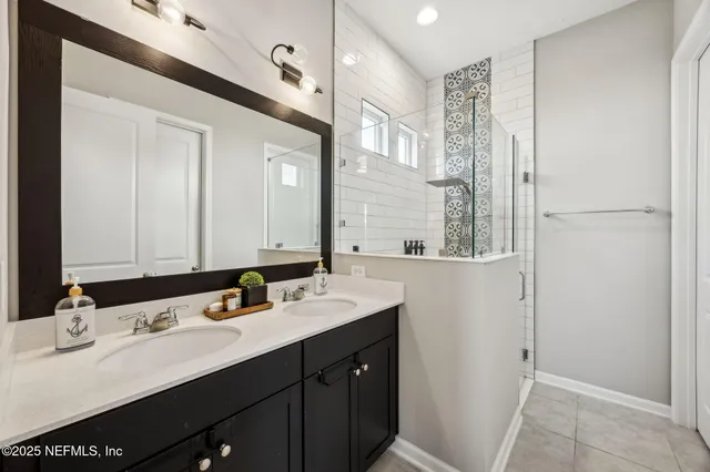 a view of a lake with houses in the back