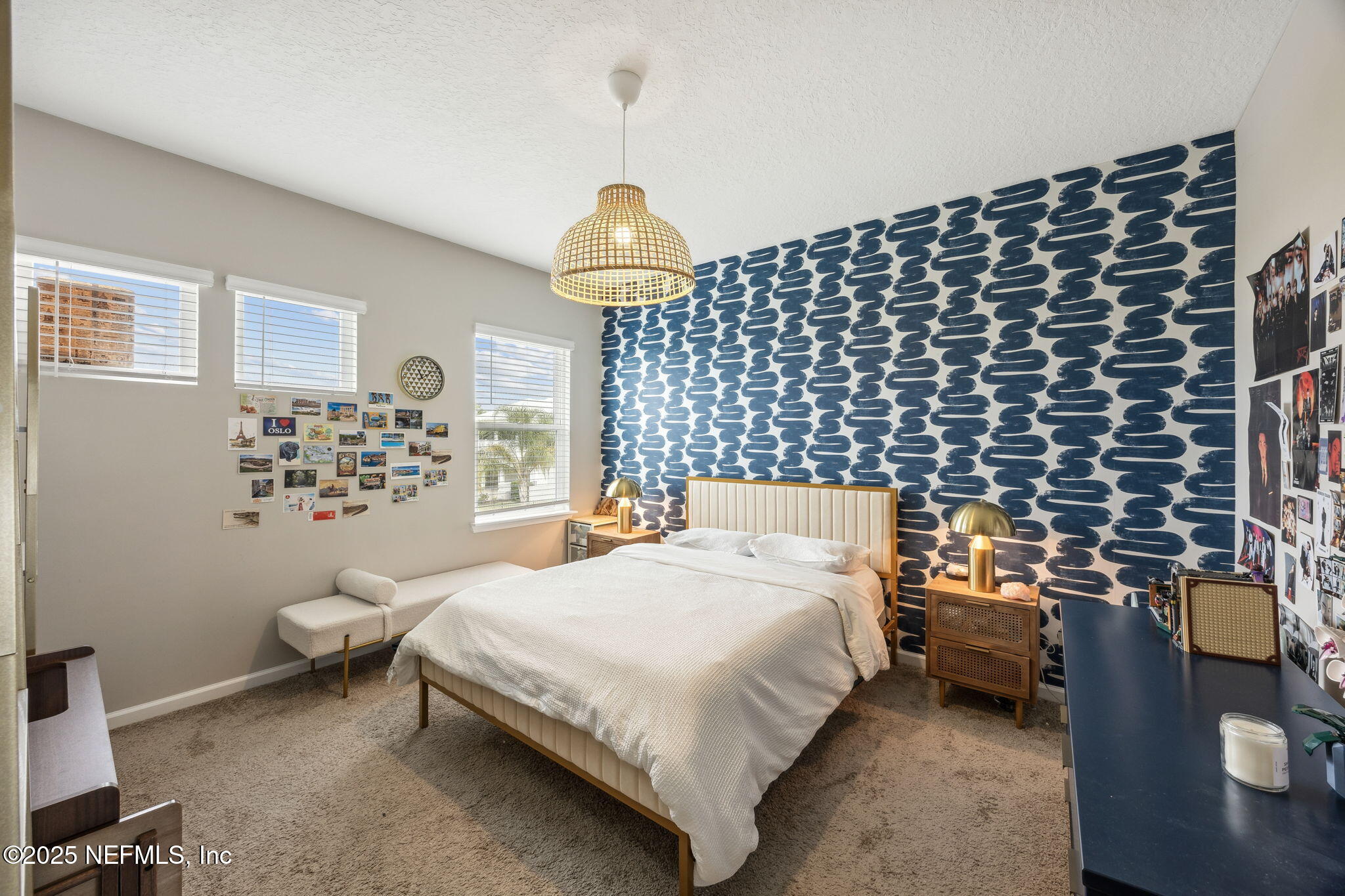 290 Rum Runner Way St. Johns, FL 32259 - Photo 33 of 105 a bedroom with a bed and a chandelier