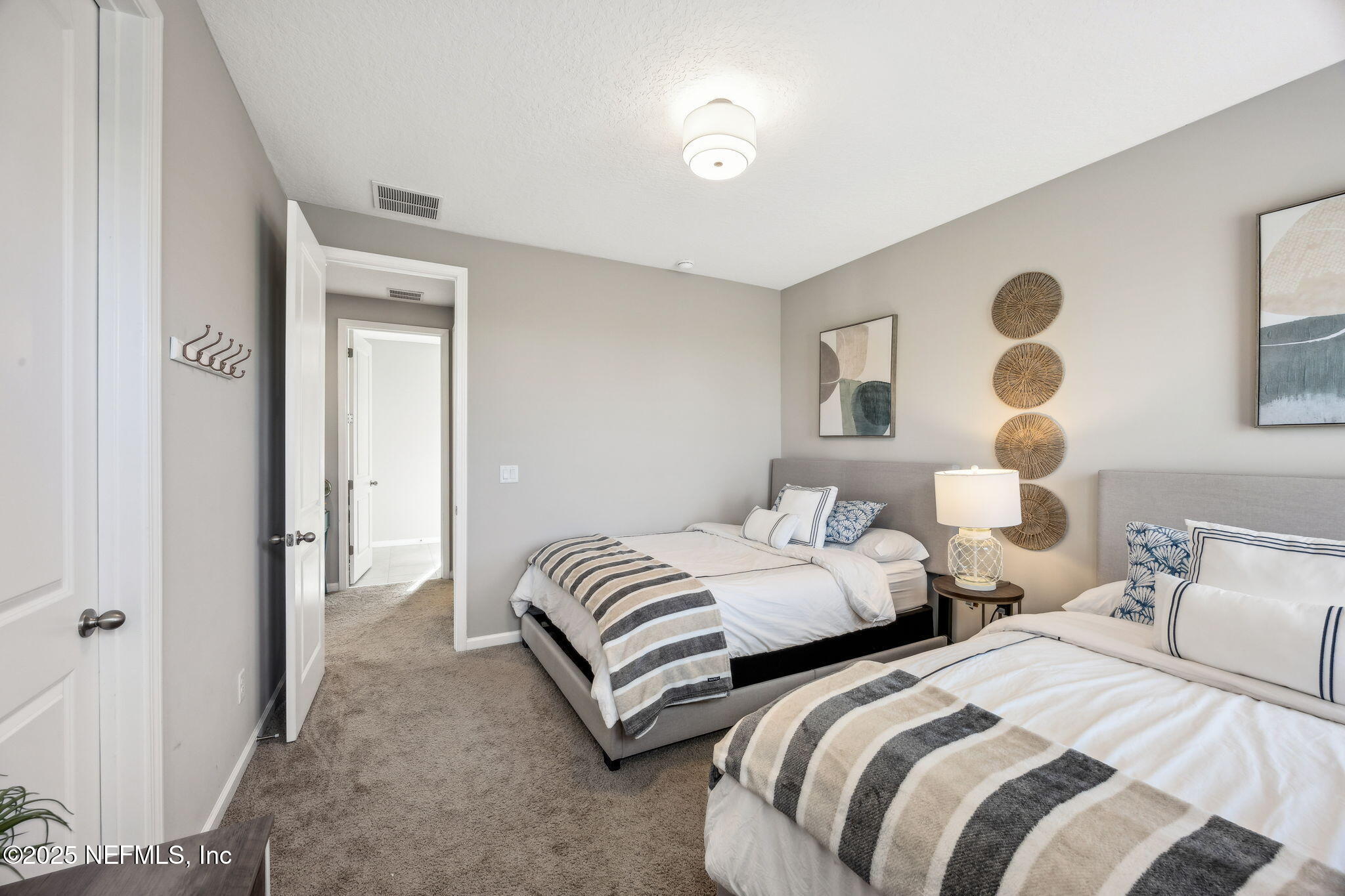 290 Rum Runner Way St. Johns, FL 32259 - Photo 38 of 105 a bedroom with two beds and painting on the wall