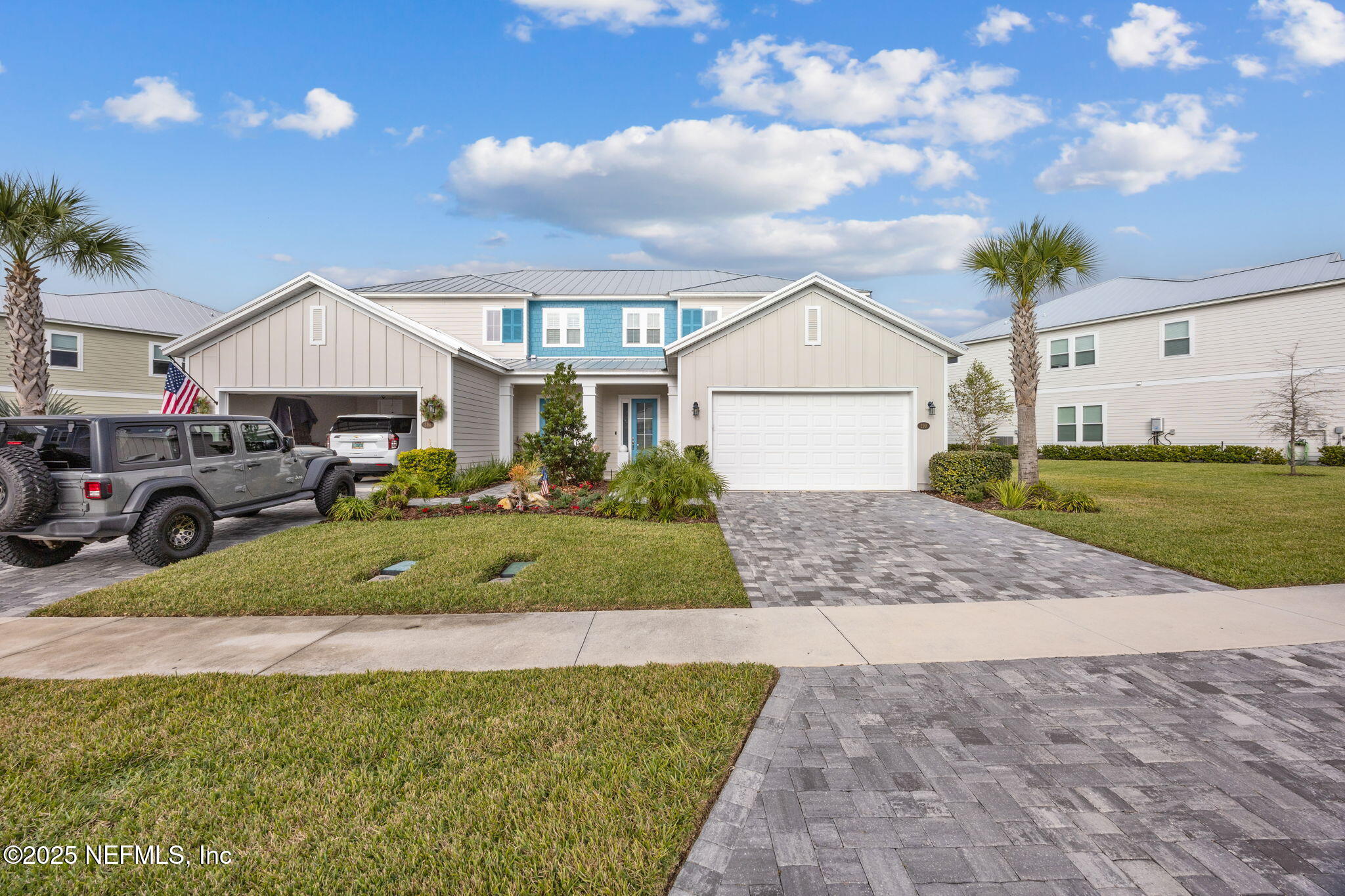 290 Rum Runner Way St. Johns, FL 32259 - Photo 5 of 105 a front view of a house with a yard and garage