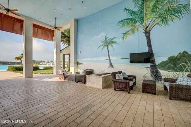an aerial view of a house with a swimming pool yard and outdoor seating