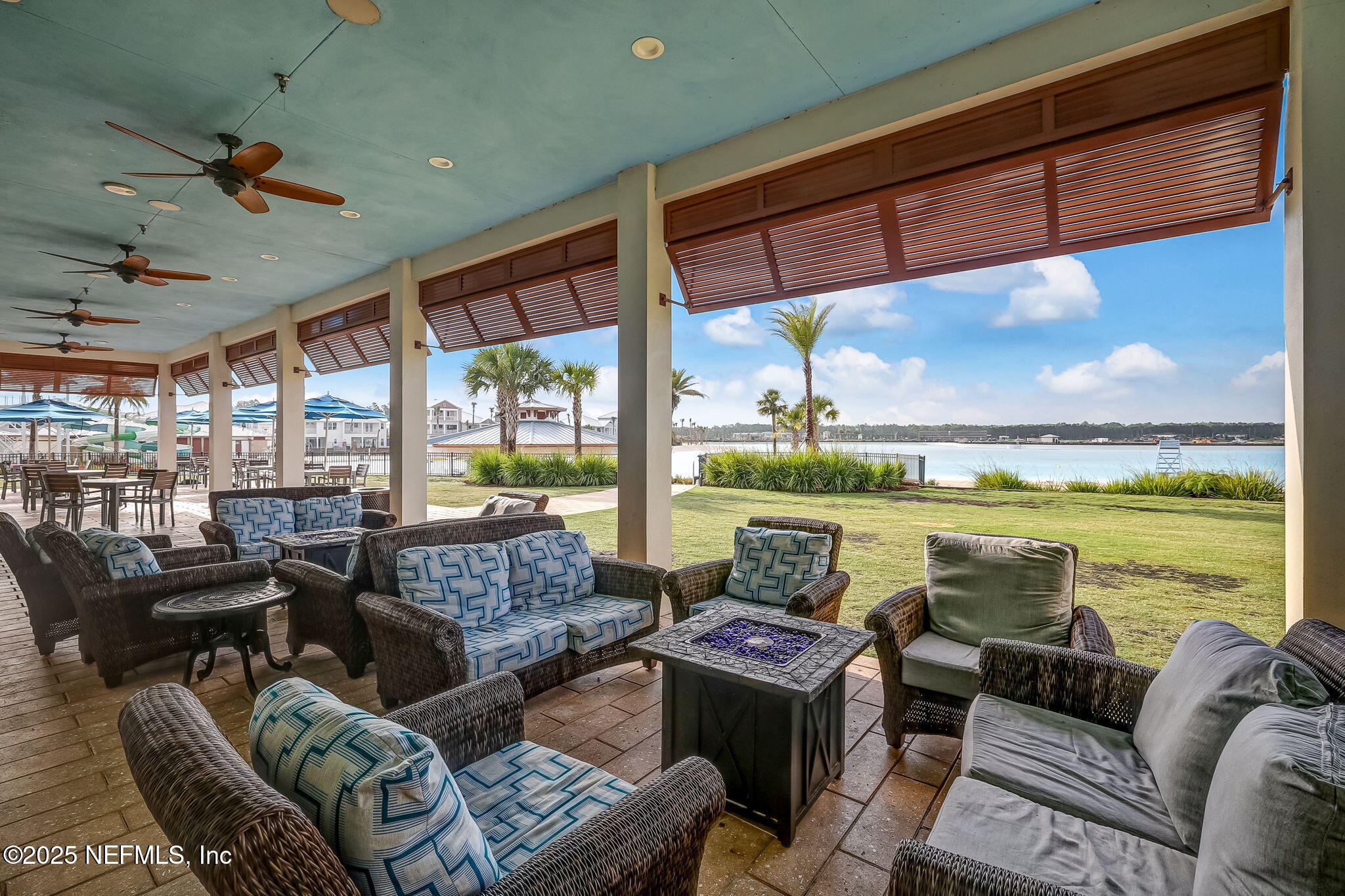 290 Rum Runner Way St. Johns, FL 32259 - Photo 53 of 105 a living room with furniture and a floor to ceiling window