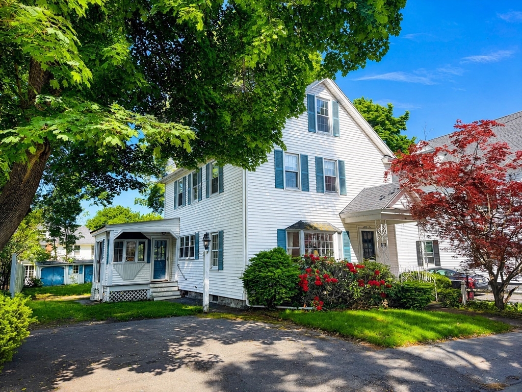 36 Plummer Avenue Lowell, MA 01852 - Photo 2 of 23 a front view of a house with a garden