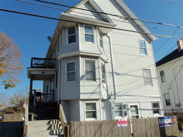 1032 Stafford Road Fall River, MA 02721 - Photo 1 of 5 a front view of a residential apartment building with a red door