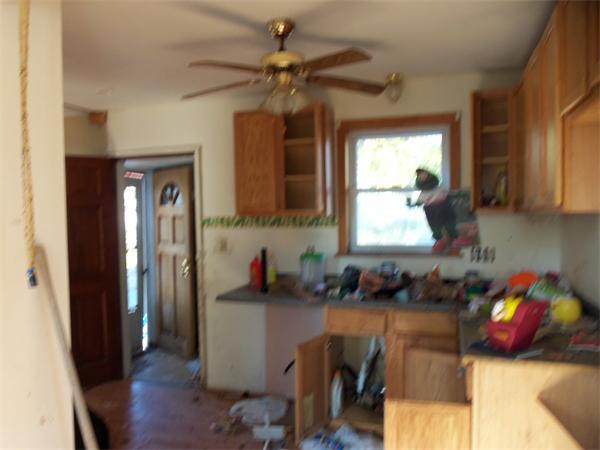 1032 Stafford Road Fall River, MA 02721 - Photo 5 of 5 a kitchen with stainless steel appliances granite countertop a refrigerator a sink dishwasher a stove a dining table and chairs with wooden floor