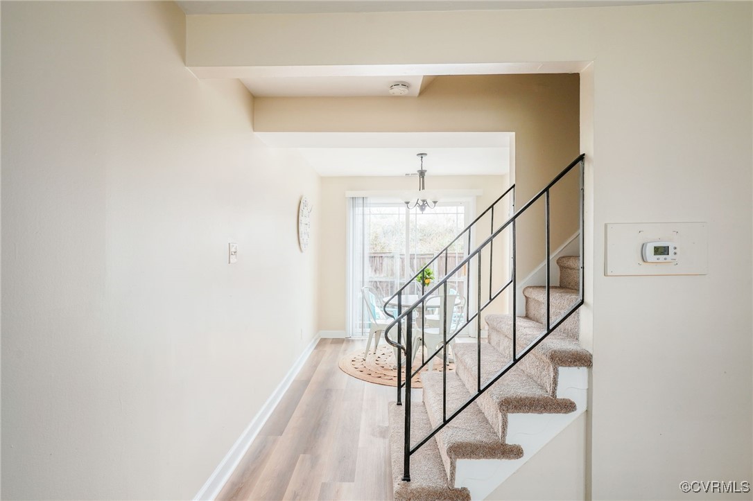 3109 North Parham Road, Unit 47 Richmond, VA 23294 - Photo 8 of 32 Stairway featuring an inviting chandelier, baseboa