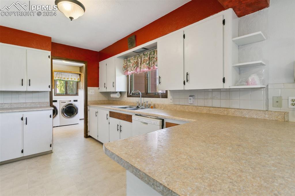519 Dakota Avenue Simla, CO 80835 - Photo 12 of 27 a kitchen with stainless steel appliances granite countertop a stove a sink and white cabinets
