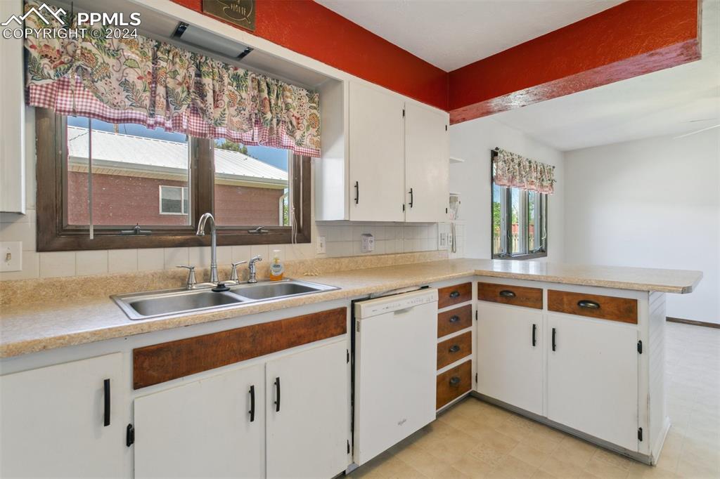 519 Dakota Avenue Simla, CO 80835 - Photo 13 of 27 a kitchen with a sink stove and cabinets
