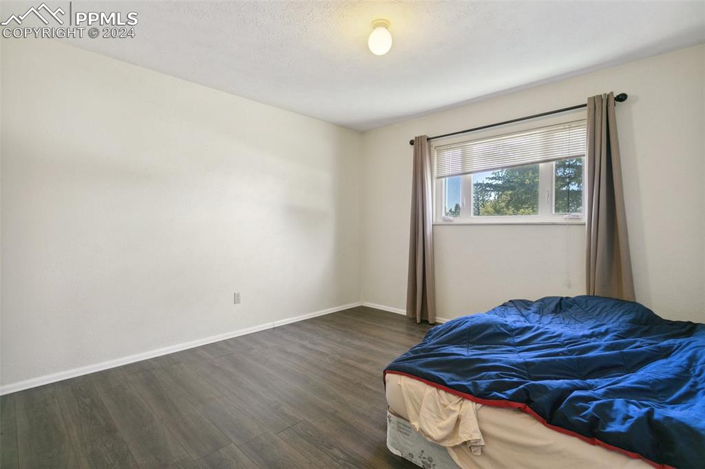 519 Dakota Avenue Simla, CO 80835 - Photo 18 of 27 a bedroom with a bed and a window