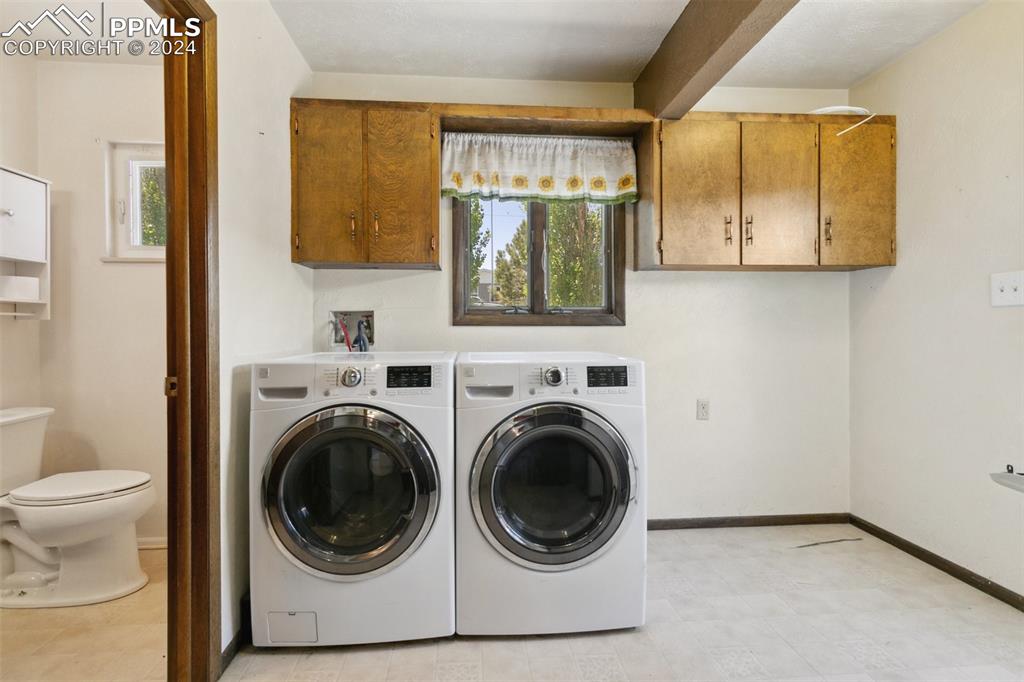 519 Dakota Avenue Simla, CO 80835 - Photo 24 of 27 a view of a hallway with washer and dryer