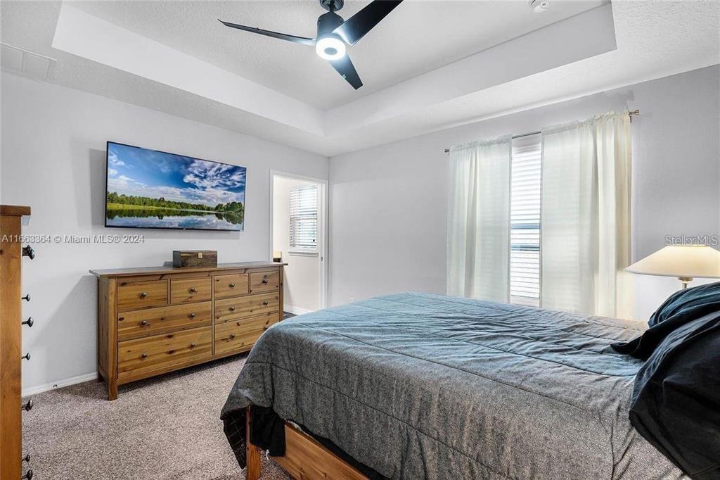 11819 Vermillion Avenue Windermere, FL 34786 - Photo 16 of 25 a bedroom with a bed and a window