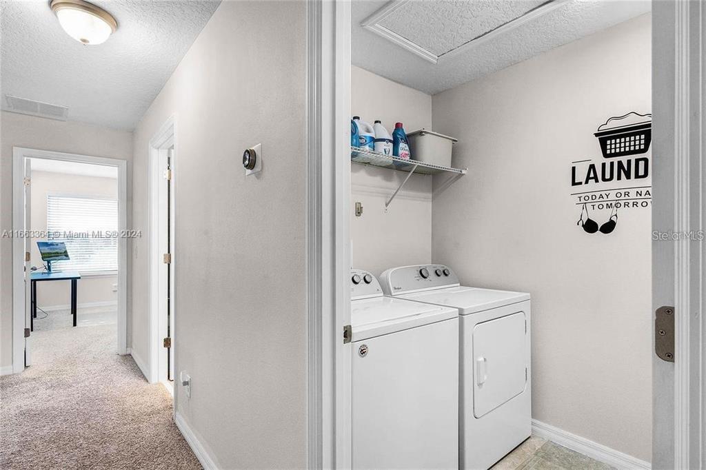 11819 Vermillion Avenue Windermere, FL 34786 - Photo 21 of 25 a utility room with dryer and washer