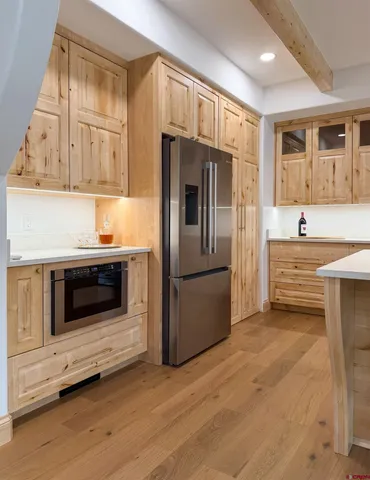 a bathroom with a sink vanity and mirror