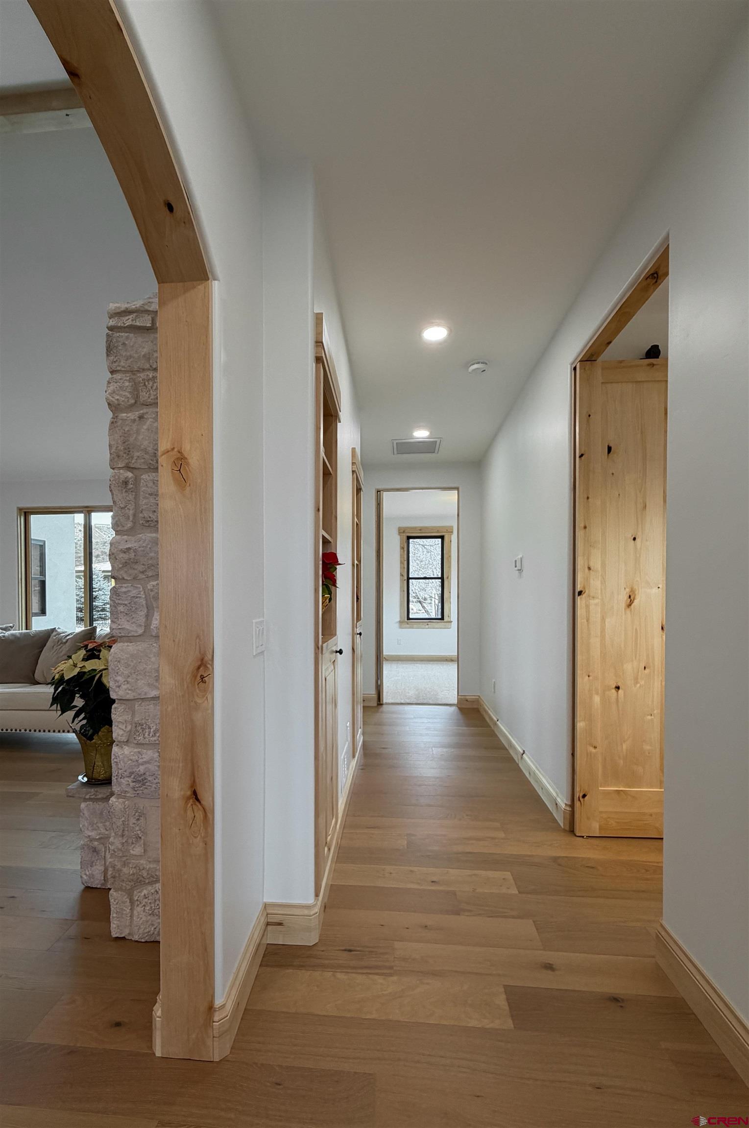 805 Southeast Pinyon Street Cedaredge, CO 81413 - Photo 30 of 45 a view of a hallway view with wooden floor and windows