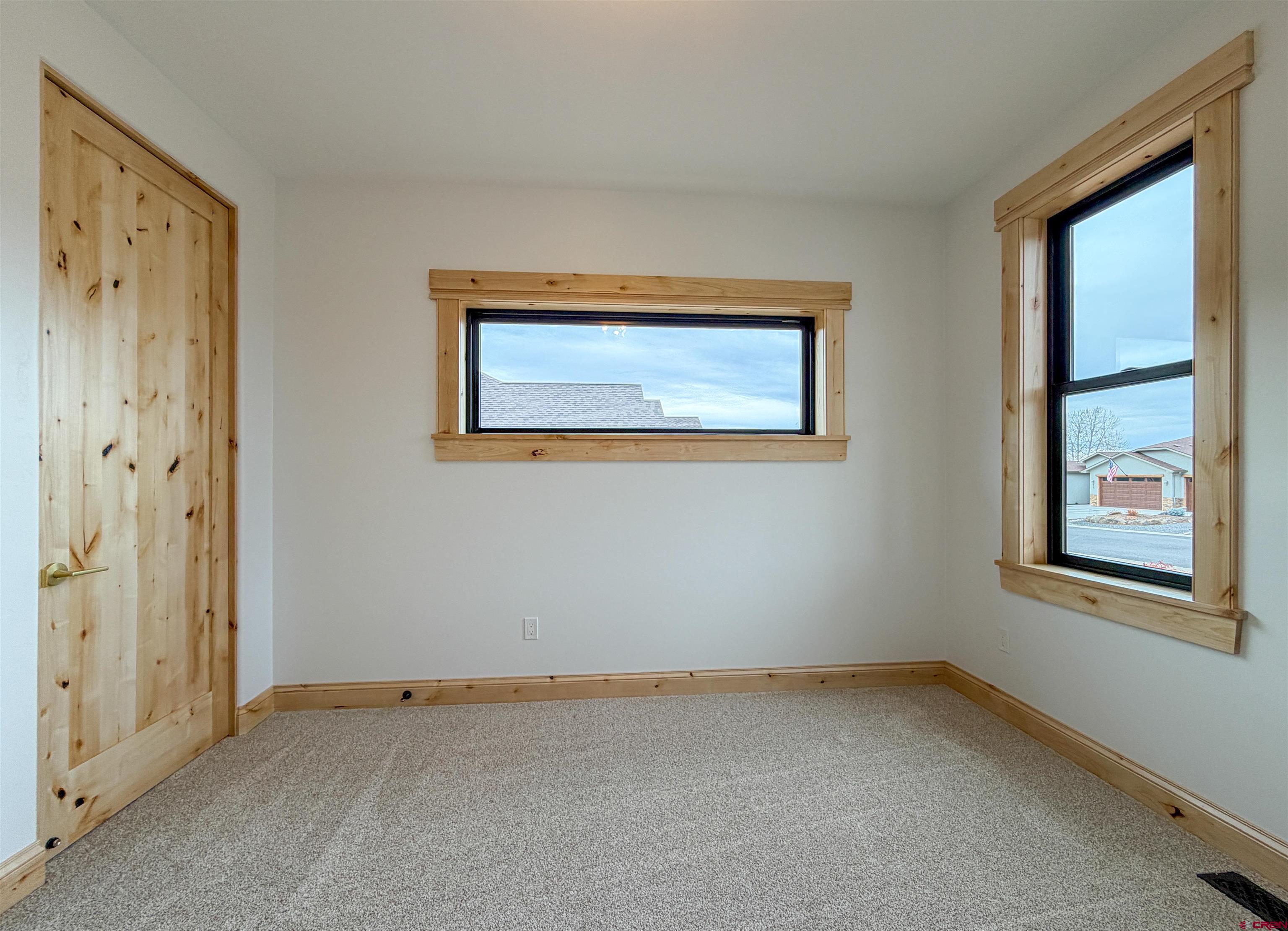 805 Southeast Pinyon Street Cedaredge, CO 81413 - Photo 32 of 45 an empty room with windows