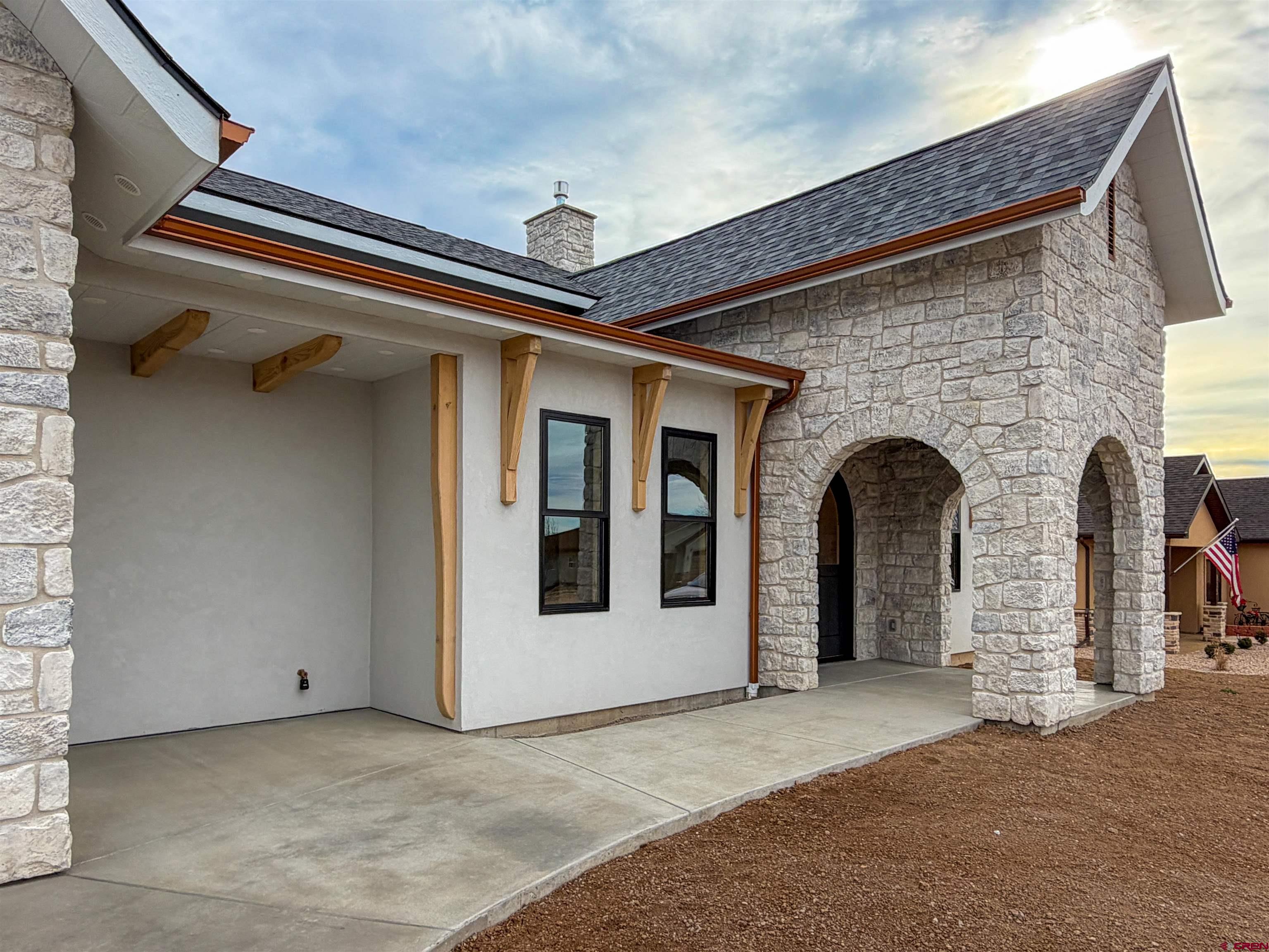 805 Southeast Pinyon Street Cedaredge, CO 81413 - Photo 4 of 45 a front view of a house with a yard