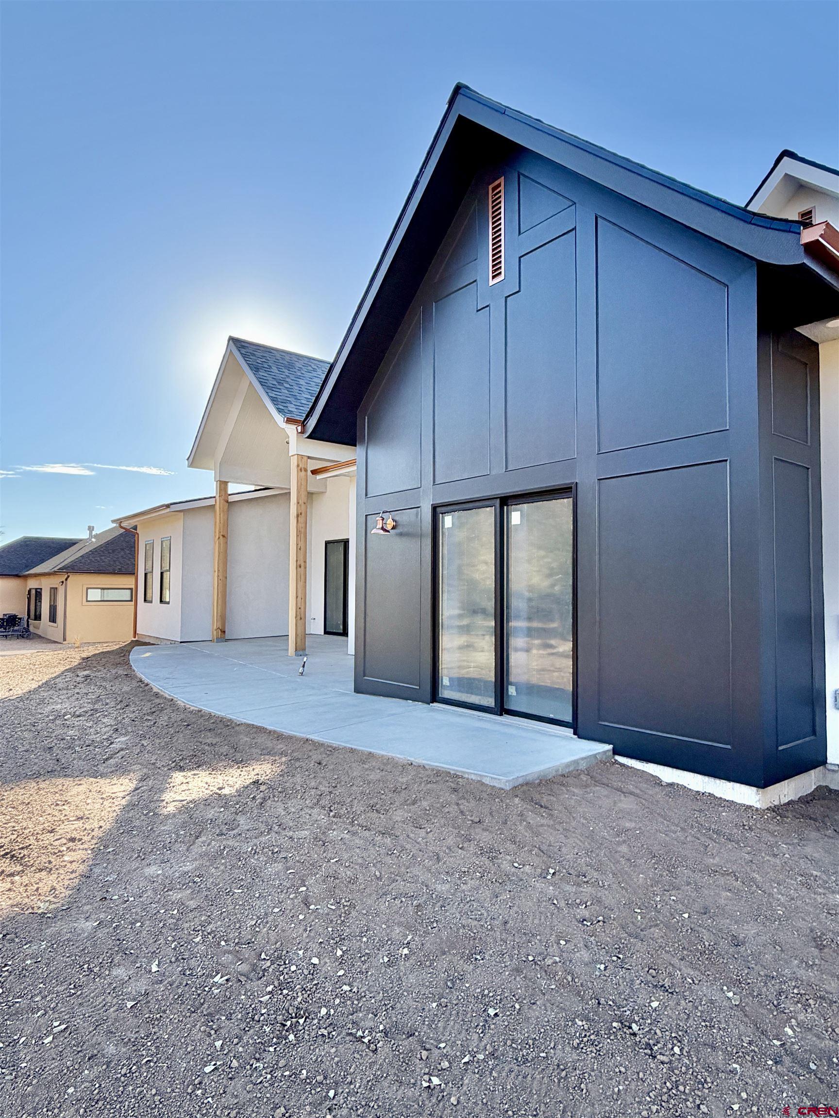 805 Southeast Pinyon Street Cedaredge, CO 81413 - Photo 42 of 45 a view of a house with a backyard