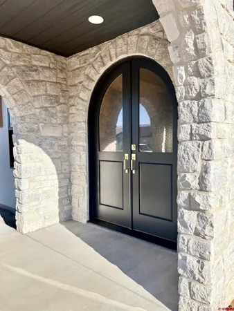 a kitchen with furniture and a wooden floors