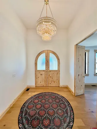 a kitchen with kitchen island a counter top space a sink stainless steel appliances and cabinets