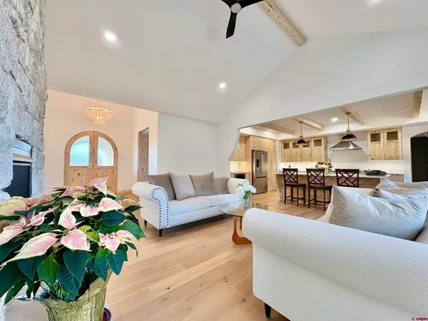 a kitchen with stainless steel appliances granite countertop a refrigerator and a stove
