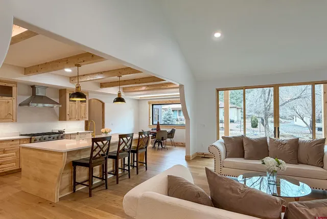 a kitchen with stainless steel appliances granite countertop a stove and a sink