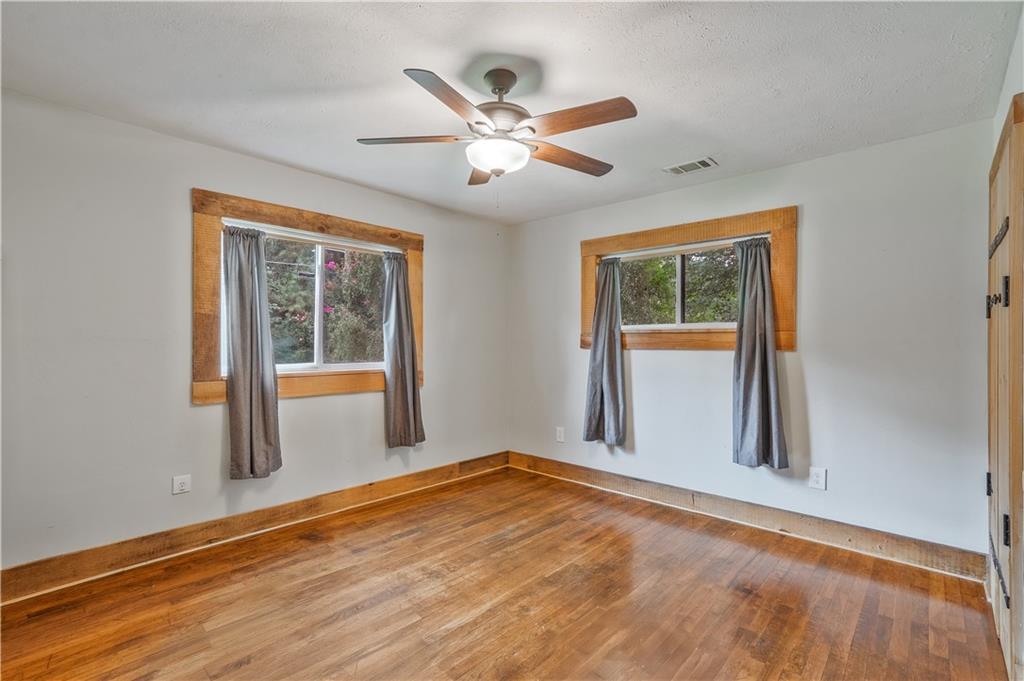 3225 Spring Drive Northwest Atlanta, GA 30360 - Photo 17 of 28 an empty room with window and ceiling fan
